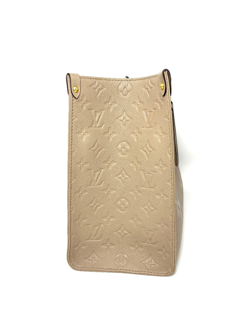 Preowned. LV On The Go MM Dove Gray Empriente. Microchip|8223