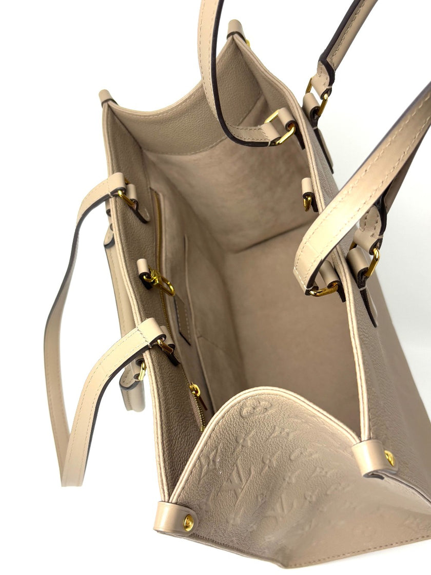 Preowned. LV On The Go MM Dove Gray Empriente. Microchip|8225