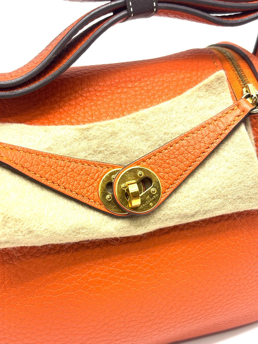 Preowned. Hermes Mini Lindy Orange Togo GHW. ZMM910CA|17825