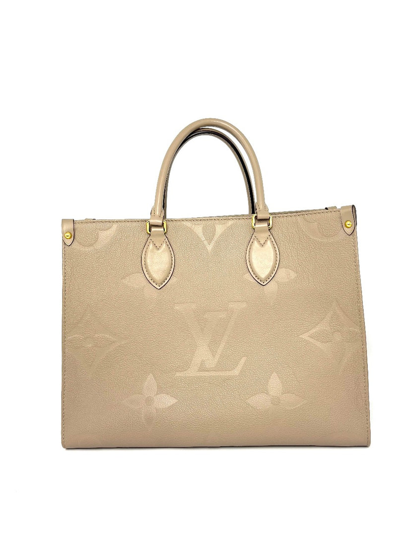 Preowned. LV On The Go MM Dove Gray Empriente. Microchip|8220
