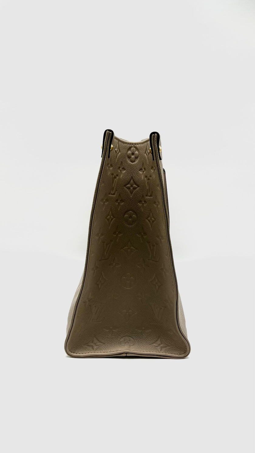 Preowned. LV On The Go MM Empreinte Dove Gray. Microchip|14583