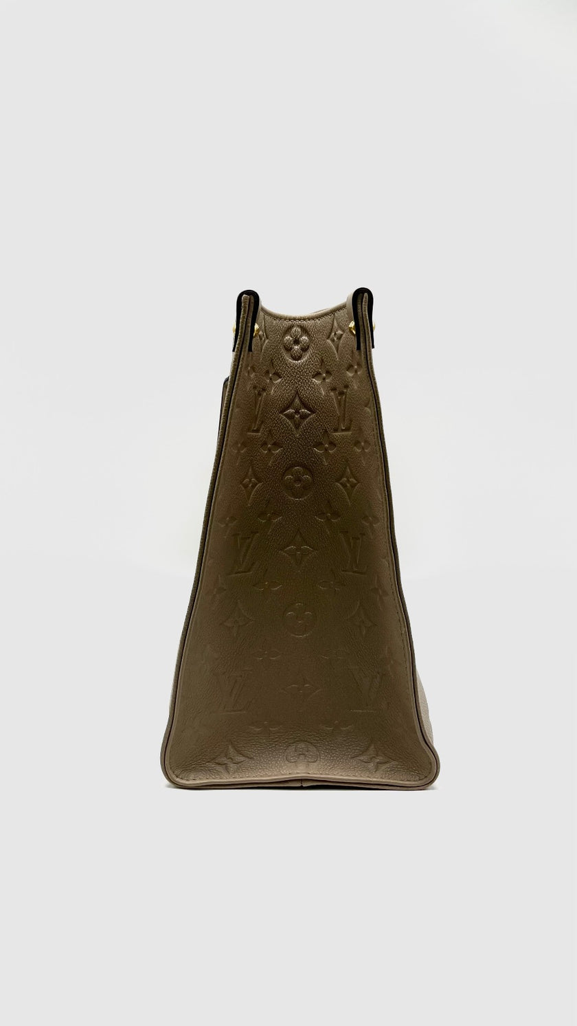 Preowned. LV On The Go MM Empreinte Dove Gray. Microchip|14585