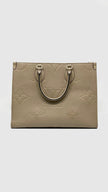 Preowned. LV On The Go MM Empreinte Dove Gray. Microchip|14584