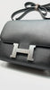 Unused. Hermes Constance 24 Black Epsom PHW. CHT917BT|9682