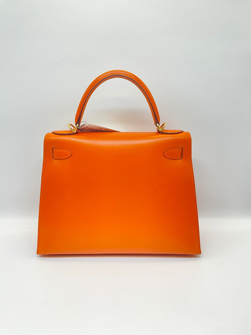 Preowned. Hermes Kelly 28 Orange Box Calf GHW. F Square N21|10065