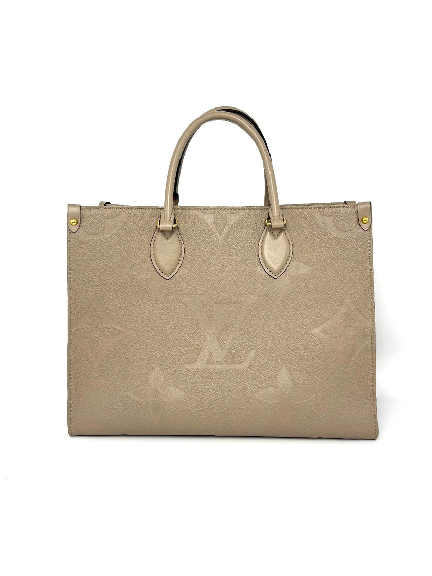 Preowned. LV On The Go MM Dove Gray Empriente. Microchip|8222