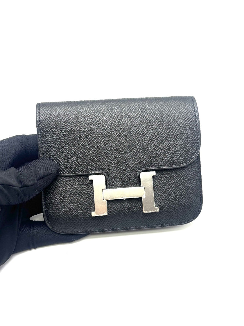 Unused. Hermes Constance Slim Black Epsom PHW. BAM009UH|17871