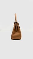 Brand New. Hermes Kelly 25 Gold Togo GHW. KMI686AS|9734