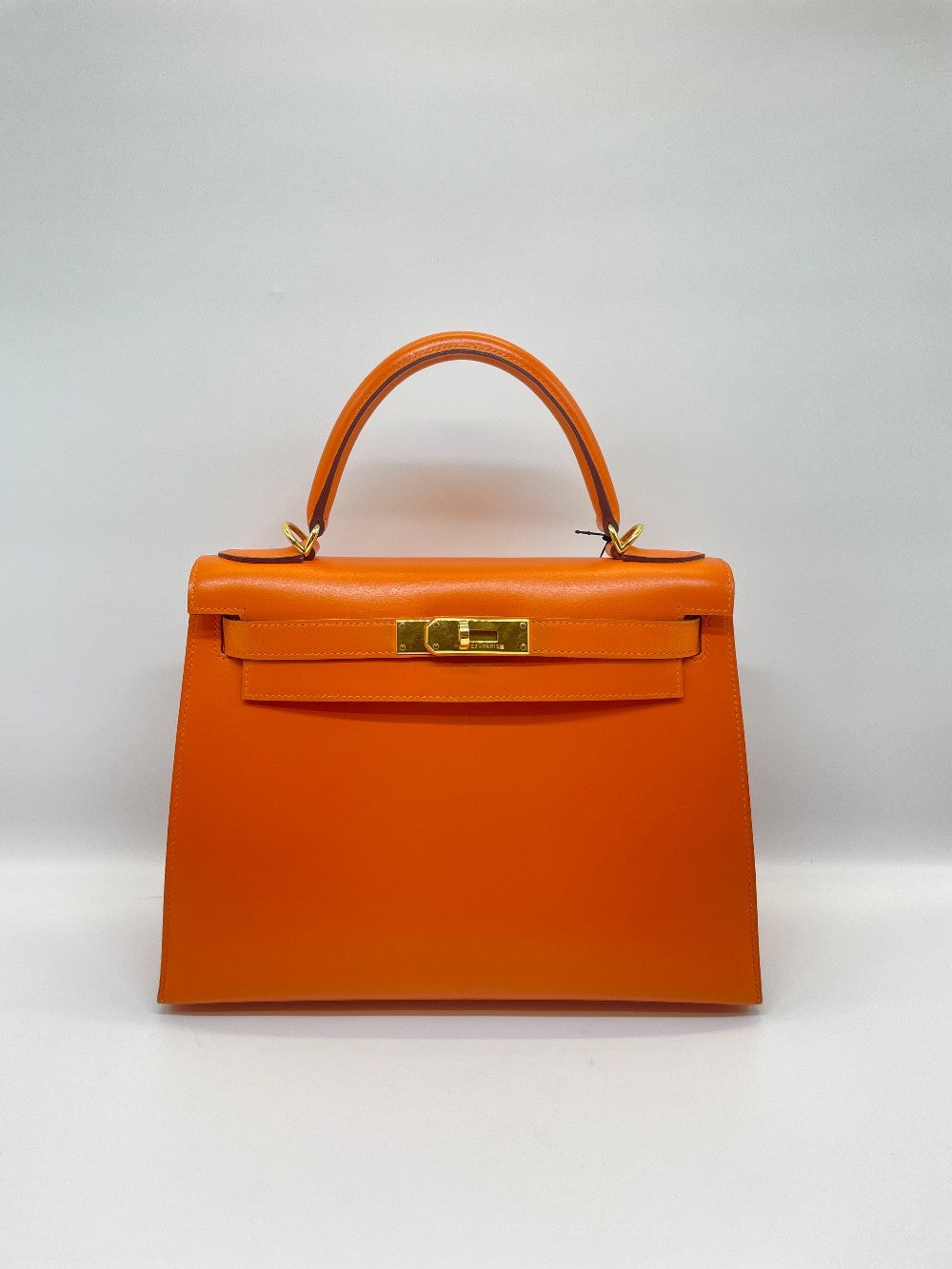 Preowned. Hermes Kelly 28 Orange Box Calf GHW. F Square N21|10064