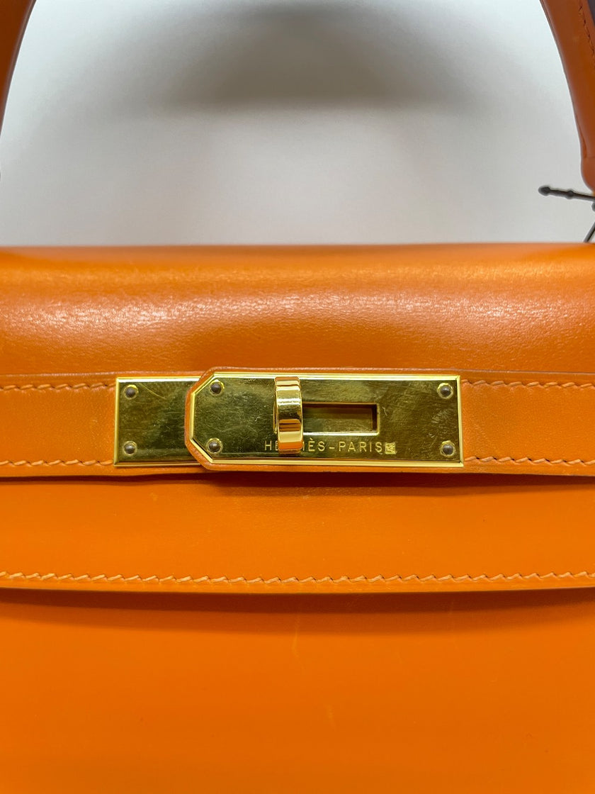 Preowned. Hermes Kelly 28 Orange Box Calf GHW. F Square N21|10069
